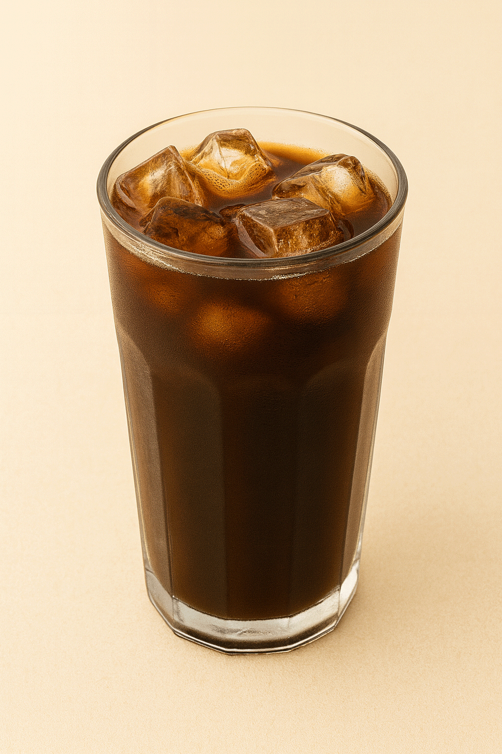 White ceramic cup filled with smooth decaf coffee on a wooden table at Neida’s Palace Donut Shop